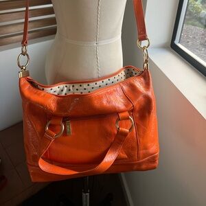 HOBO vintage orange leather bag with black and white polka dot lining